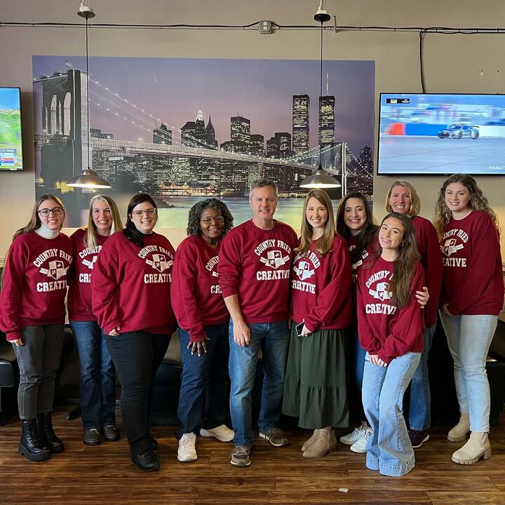 Members Of The Cfc Team Pose With Their New Company Sweatshirts T-Shirt Photo