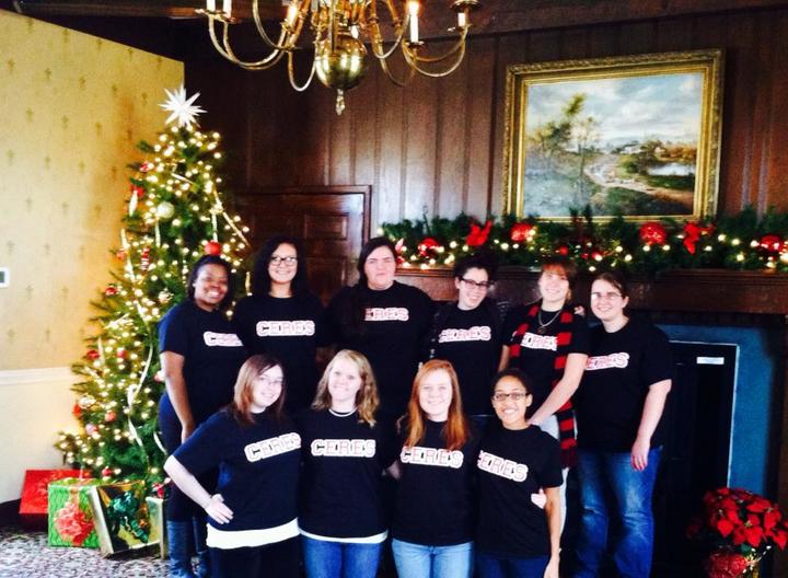 Gathered Aaround The Christmas Tree T-Shirt Photo