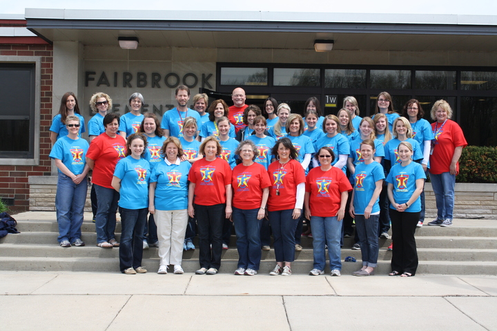 Staff Proudly Shows Off Superhero Spirit T-Shirt Photo