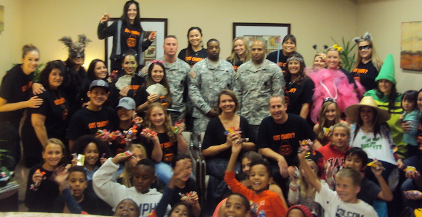 How Drs. Allen & Kelly Smudde Got Local Kids To Give Up Their Candy (And Bring Smiles To Troops Overseas!) T-Shirt Photo