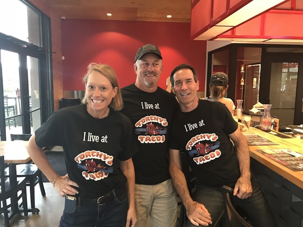 We Live At Torchy's Tacos ! T-Shirt Photo