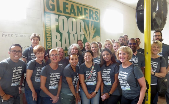 The Residential Team Volunteering At Gleaners Community Food Bank T-Shirt Photo