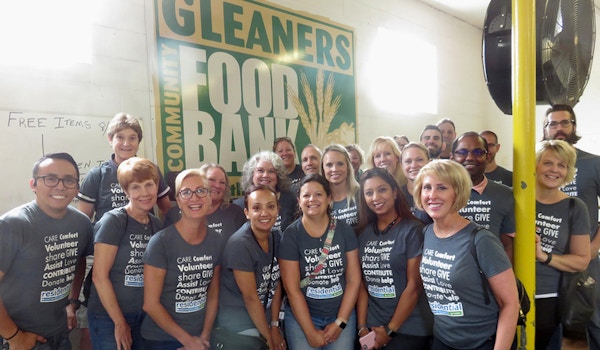 The Residential Team Volunteering At Gleaners Community Food Bank T-Shirt Photo
